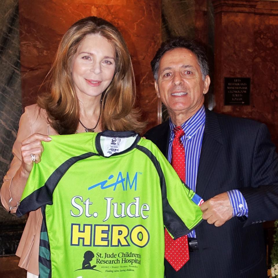 Queen Noor Al Hussein receiving an Honary iAM St. Jude Heroes Jersey from Chairman of the Anthony R. Abraham Foundation